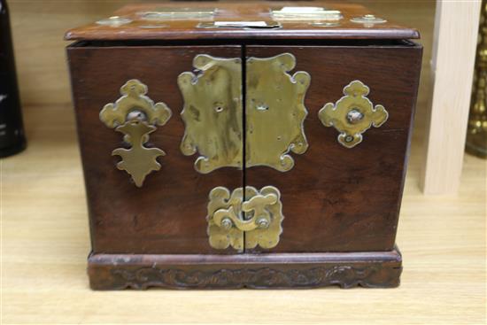 A Chinese brass mounted hardwood box, fitted numerous compartments